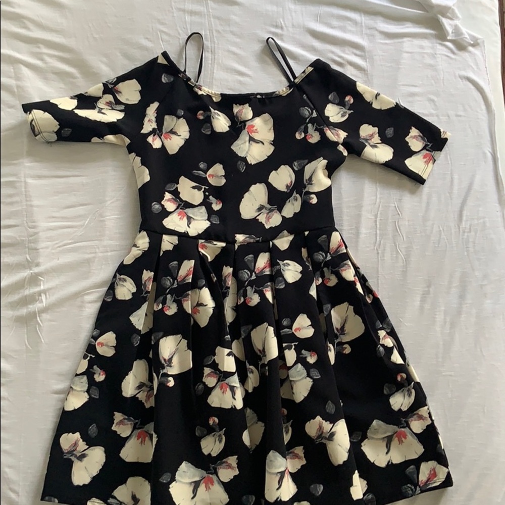 A scuba dress with big white flower designs